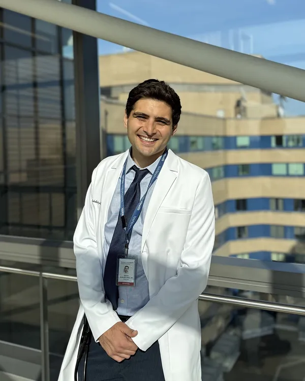 David Maglakelidze, MD, in a white coat with stethoscope at Yale New Haven Hospital